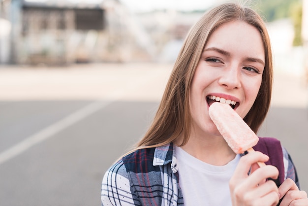 Attractive woman eating popsicle icecream