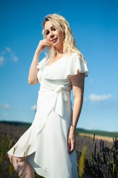 Attractive woman on the lavender field have fun