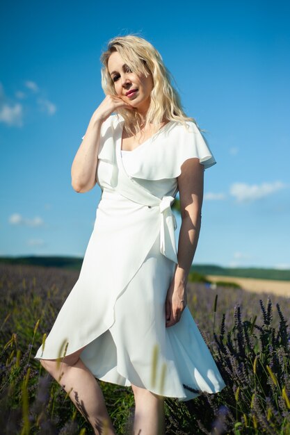 Attractive woman on the lavender field have fun