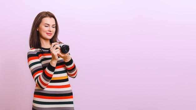 attractive woman looks at the camera screen and smiles Copy space Photography training concept