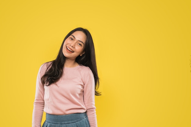 Attractive woman smiling happily shaking her head sideways