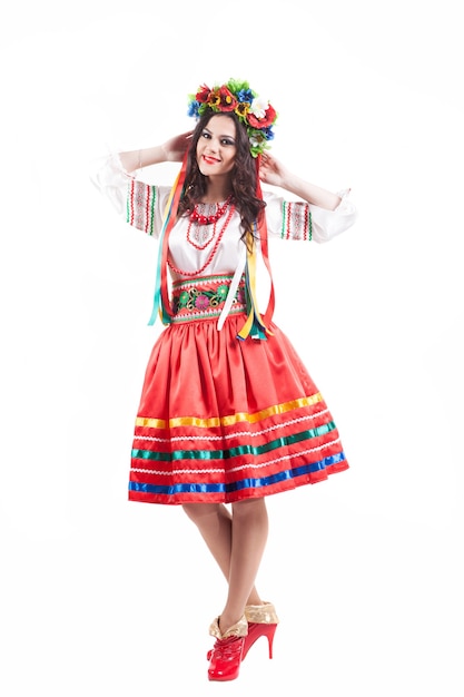 Attractive woman wears Ukrainian national dress isolated on white background