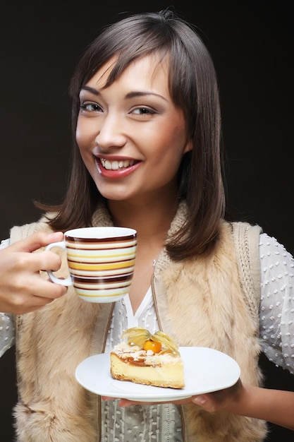 Attractive woman with coffee and dessert