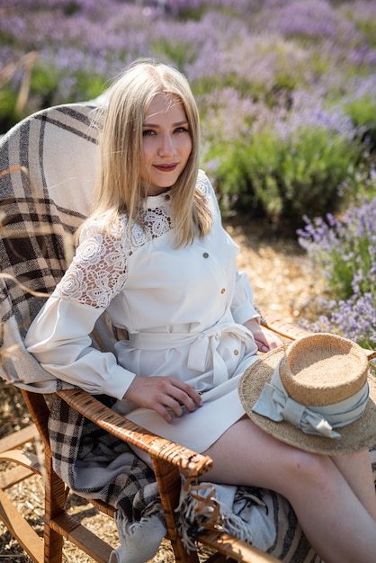 Attractive woman with fashion makeup posing on lavender field