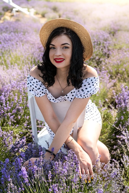 Attractive woman with fashion makeup posing on lavender field