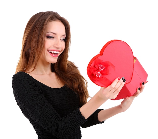 Attractive woman with gift box in form of heart, isolated on white