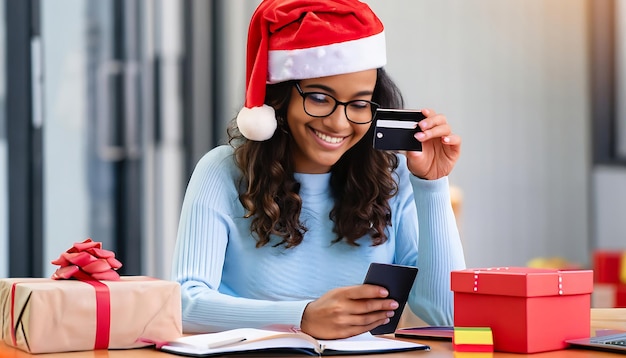 Attractive Woman with Santa Claus Hat and Eyeglasses Holding Bank Card