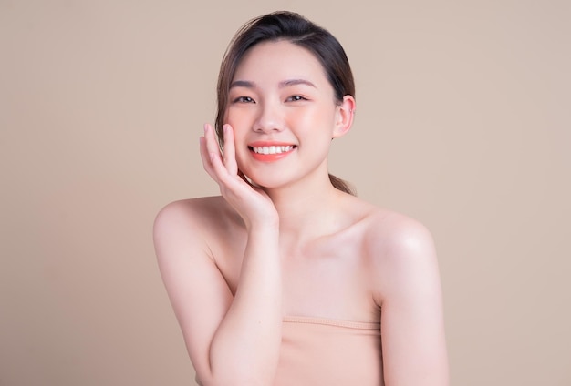 Attractive young Asian woman with fresh skin Face care facial treatment woman beauty skin isolated on white background cosmetology beauty skin and cosmetic concept