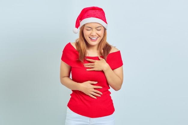 Attractive young Asian woman with laughing face on white background