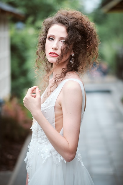 Attractive young bride in wedding dress