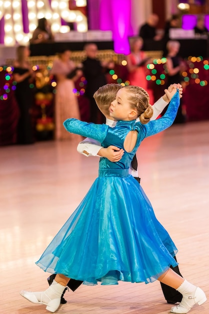 Attractive young couple of children dancing ballroom dance Girl and boy dancer international dancing