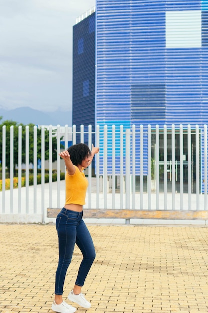 Attractive young female tourist explores a city on foot