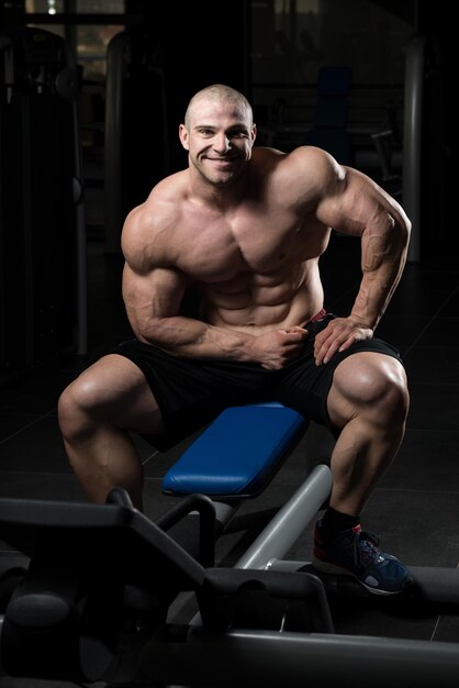 Attractive Young Man Resting In Gym Afther Exercise