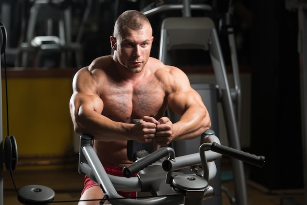 Attractive Young Man Resting In Gym Afther Exercise