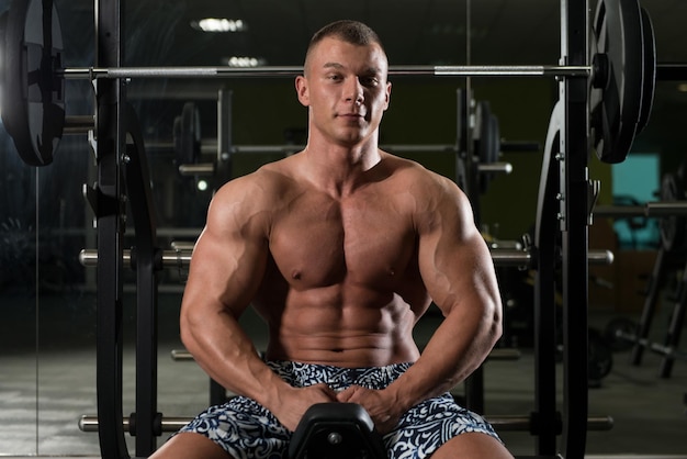 Attractive Young Man Resting In Gym Afther Exercise