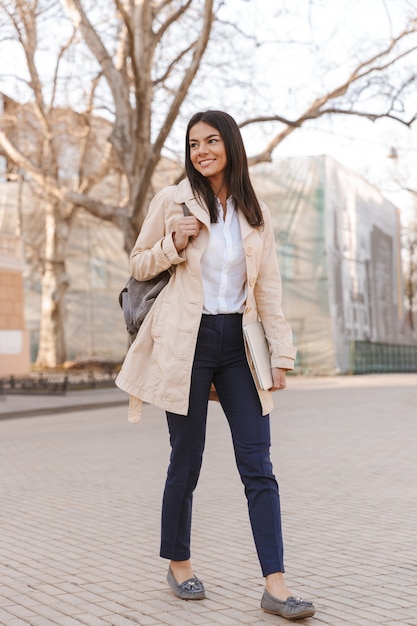 Attractive young woman dressed in autumn coat