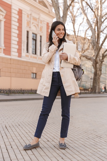 Attractive young woman dressed in autumn coat