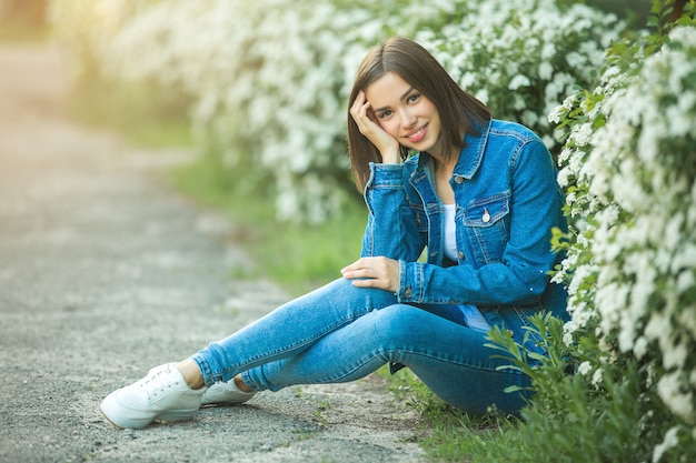 Attractive young woman outdoors. Close up portrait of beautiful female.