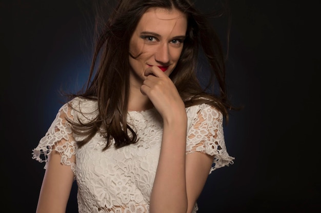 Attractive young woman with magnificent hair at studio