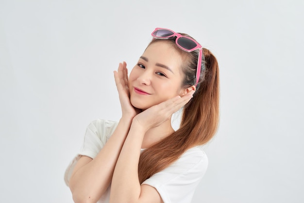 Attrative young Asian girl portrait over white background