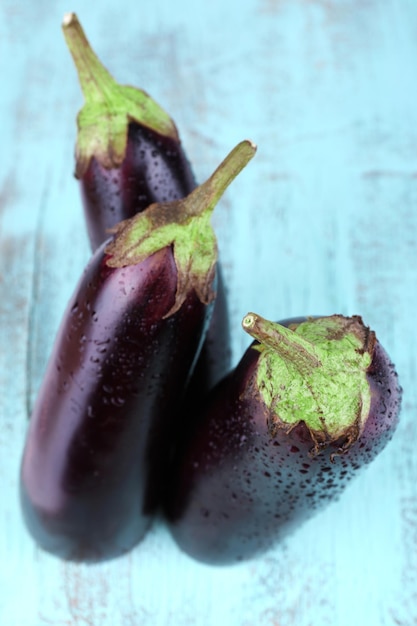 Aubergines on wooden background