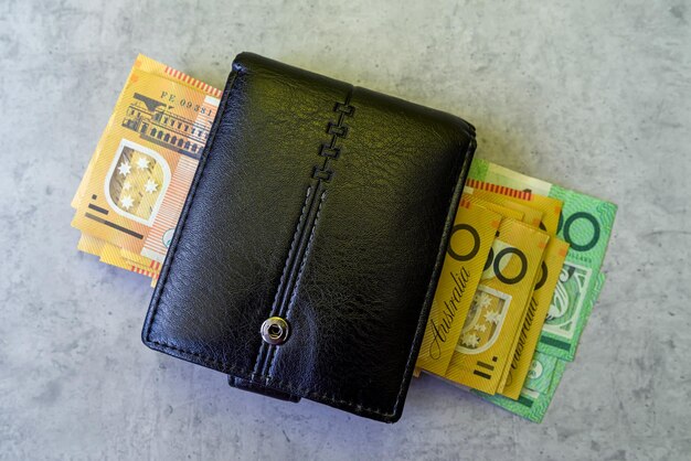 Aud Australian money in black male leather purse