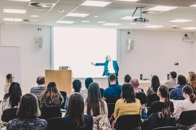 Audience in lecture hall on scientific conference