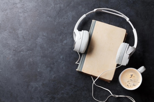 Audio book concept Headphones coffee and book