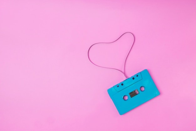 Audio tape cassette retro vibes Minimal romance concept on pink pastel background