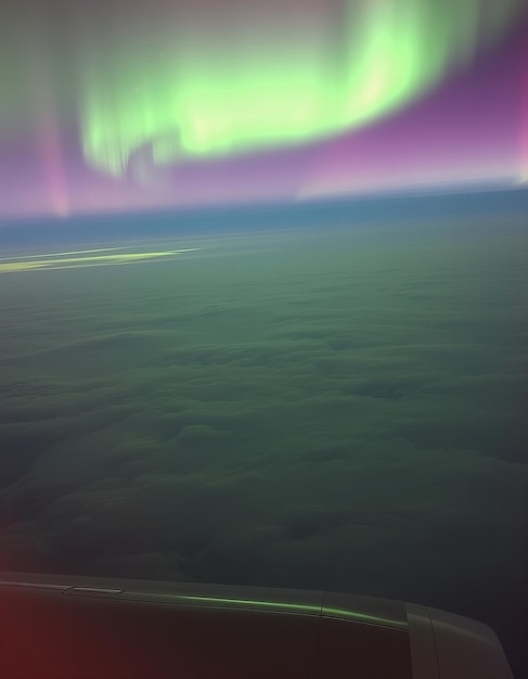 Photo aurora borealis seen from an airplane night sky natural phenomenon northern lights