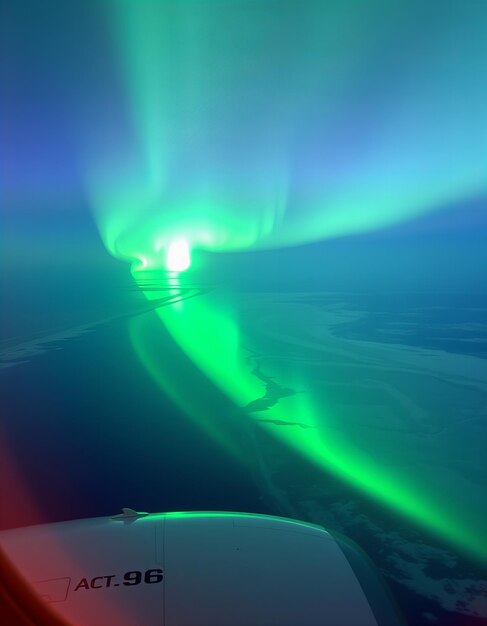 Photo aurora borealis seen from an airplane night sky natural phenomenon northern lights