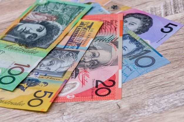 Australian dollar banknotes on wooden table background