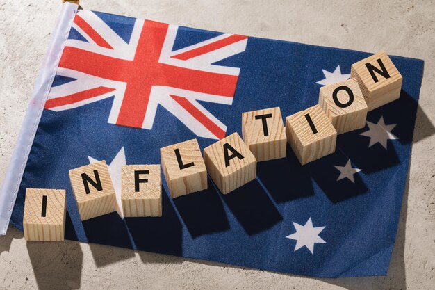 Australian flag and wooden cubes with text, concept on the theme of inflation in Australia