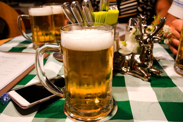 Austran beer in big glass on table for drinking at dinner in restaurant at Pfunds village in Tyrol Austria