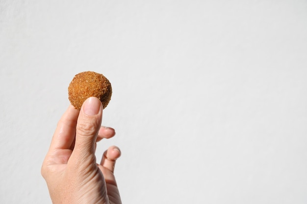 Authentic Sri Lankan cutlets snack street foods short eats in female hand