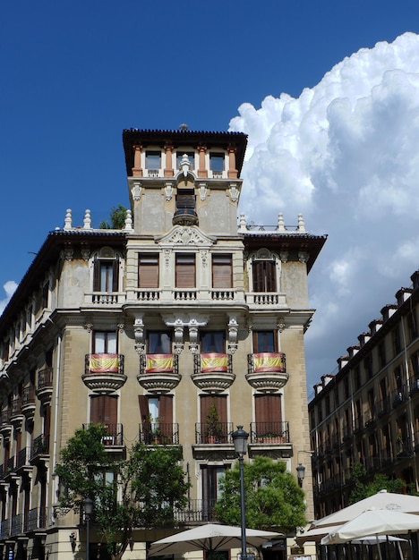 Authentic vintage building against vivid sky from outside downtown Madrid Spain