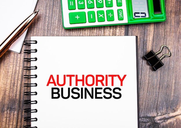 AUTHORITY BUSINESS text concept on notepad Financial business concept