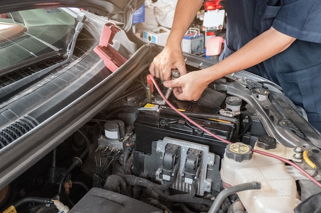 Auto mechanic repairing in a engine car