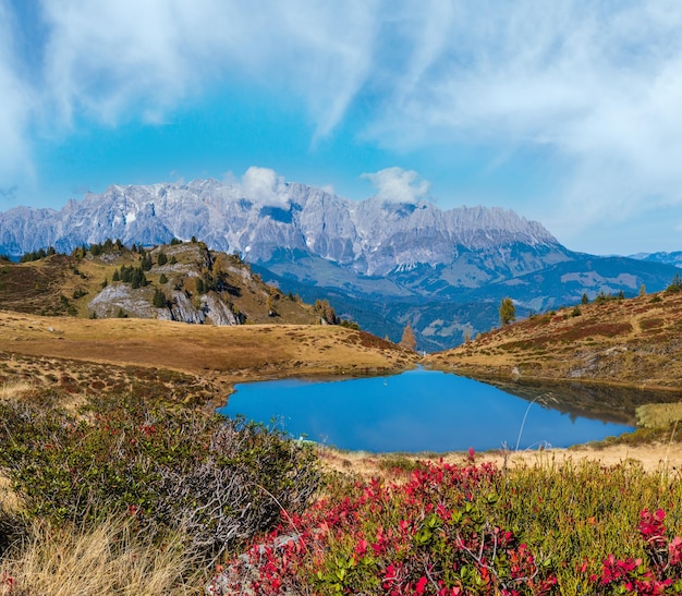 Autumn alpine Kleiner Paarsee or Paarseen lake Land Salzburg Austria Alps Hochkonig rocky mountain group view in far