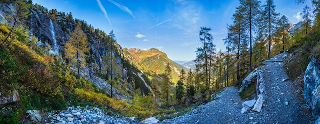 Autumn alpine waterfall view from mountain hiking path to Tappenkarsee Kleinarl Land Salzburg Austria Picturesque hiking seasonal and nature beauty concept scene