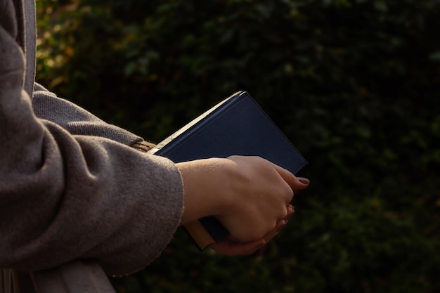 Autumn atmosphere vintage book in womans hands