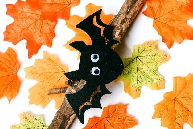 Autumn background Autumn leaves and bat Happy Halloween