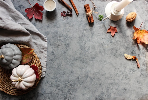 Autumn background with colored red leaves on grey slate background Top view copy space