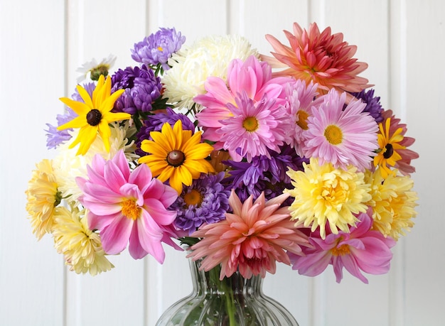 Autumn bouquet of asters dahlias and chrysanthemums on a white background