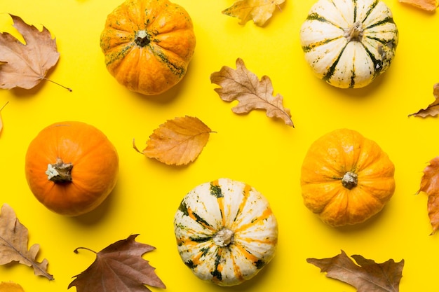 Autumn composition Pattern made of dried leaves and other design accessories on table Flat lay top view