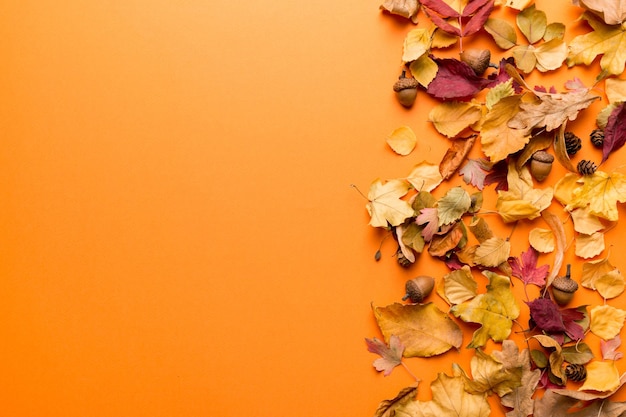 Autumn composition Pattern made of dried leaves and other design accessories on table Flat lay top view