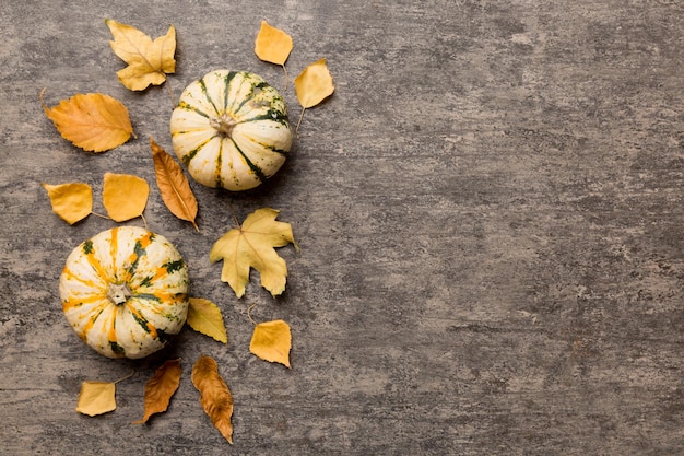 Autumn composition Pattern made of dried leaves and other design accessories on table Flat lay top view