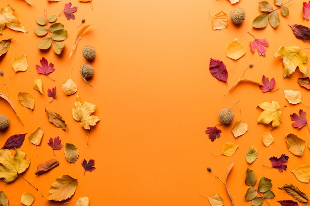 Autumn composition Pattern made of dried leaves and other design accessories on table Flat lay top view