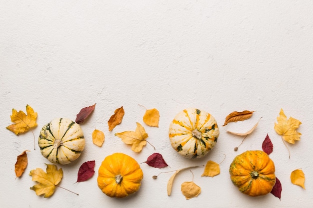 Autumn composition Pattern made of dried leaves and other design accessories on table Flat lay top view