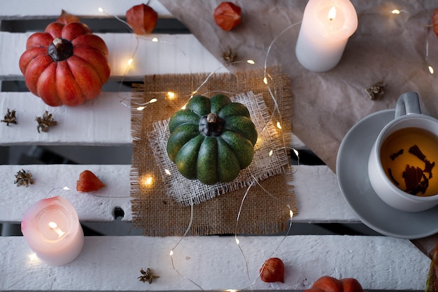 Autumn decor of pumpkins and candles in october idea for halloween